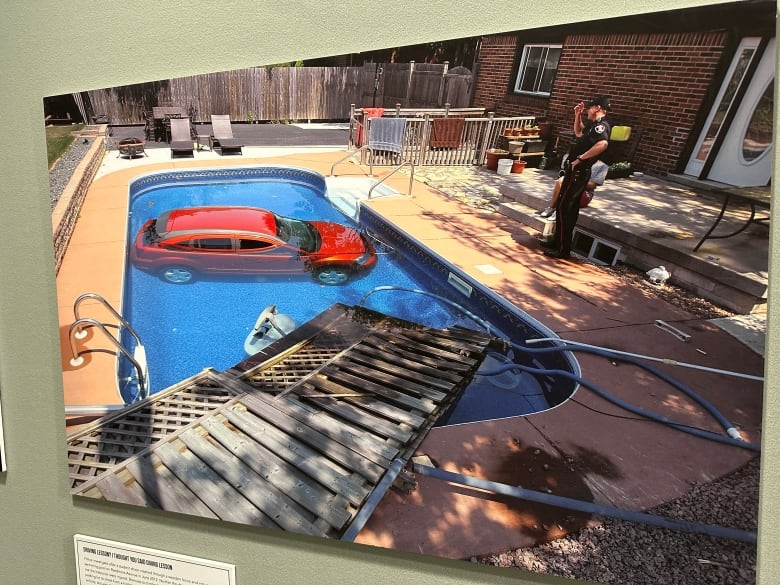 Photo of a vehicle in a backyard pool.