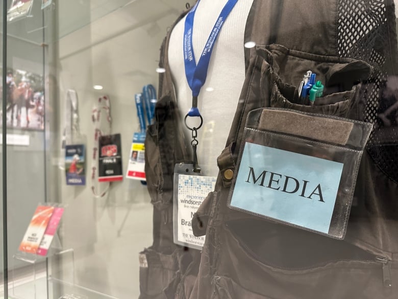 Media kit in a glass case at a museum.